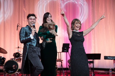 Max on stage with his wife Emily, adopted dog Wink and Susanne Kogut president of the Petco Foundation following his performance to kick off the Lifesaving Awards.