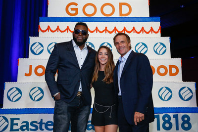 Pictured in front of a 20-foot cake by Montilio’s at Eastern Bank’s 200th anniversary celebration are left to right: Eastern Bank’s Partners For Good David Ortiz, Aly Raisman and Doug Flutie.