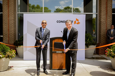 Conduent Incorporated's CEO Ashok Vemuri and North Carolina Governor Roy Cooper celebrate the opening of Conduent's technology and innovation hub in Morrisville, N.C.