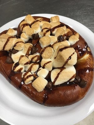 The S'mores Loaded Pretzel combines two all-time favorites. What could be better than a soft pretzel, melted marshmallow, chocolate and graham cracker crumbs?