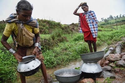 In India, 163 million people live without access to clean water close to home. Women collect dirty water from an open spring in Tanya Village, Madhya Pradesh, India. Water Aid provides clean water, decent toilets and hygiene education for communities in need. (WaterAid/ Ronny Sen)