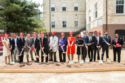 Corporate executives and District officials celebrate the groundbreaking of Stevens Place and Stevens School