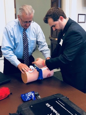 Alistiar Kent, MD, MPH, teaches a Congressional staffer how to apply a tourniquet during a Stop the Bleed training session on Monday, cosponsored by Rep. Mike Thompson (D-CA) and the American College of Surgeons.