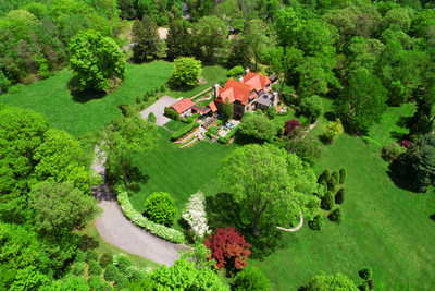 The stately residence sits on 3.6 private acres within the desirable West Mountain Estates community in Ridgefield, CT. The property’s gardens were originally designed by Warren Manning, who was known for working on the Biltmore Estate and for his presentation at the 1893 Chicago World Fair. Discover more at CTLuxuryAuction.com.