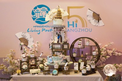 The birthday-themed cake takes the shape of Hangzhou's signature landmarks and folktales