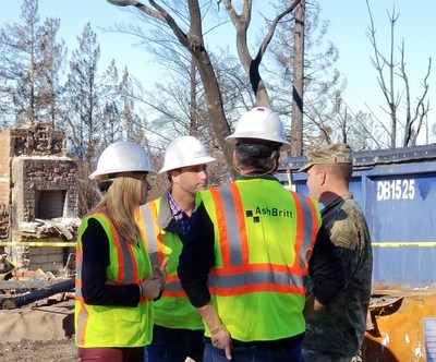 AshBritt CEO Brittany Perkins, left, discussing clean-up operations with employees from AshBritt and the U.S. Army Corps of Engineers.
