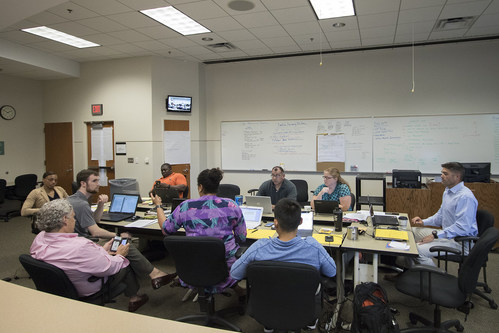 Homeland security master’s students formulate an emergency plan for a long-term blackout during their simulation-style practicum July 18 at the KU Edwards Campus in Overland Park.