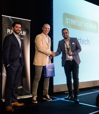 Attila Toth, Founder & CEO of zesty.ai receives the People's Choice Award for Most Innovative Insurtech Startup from Ali Safavi, Global Head of Insurtech and Hutch Moragne, Corporate Partnerships Manager at Plug And Play