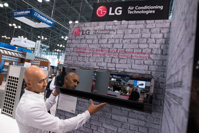 Romeo Sy, senior distribution manager for LG Electronics' Air Conditioning Technologies division, demonstrates the smart functionality of LG's industry-leading HVAC systems including the Wi-Fi-enabled Art Cool Mirror indoor unit at the 2018 American Institute of Architects (AIA) Conference on Architecture Expo in New York, June 21-22.