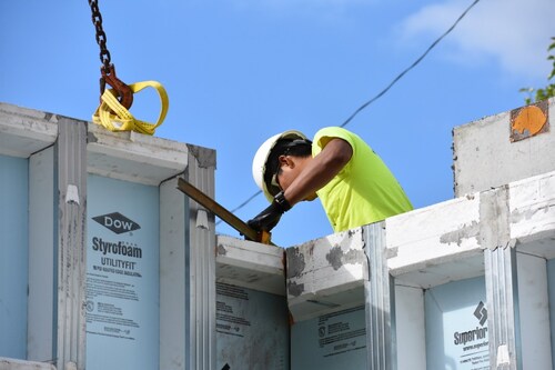 Superior Walls employee works on installation of a precast concrete wall foundation. The U.S.A. company expects to manufacture and install 6,000 systems in 2018.