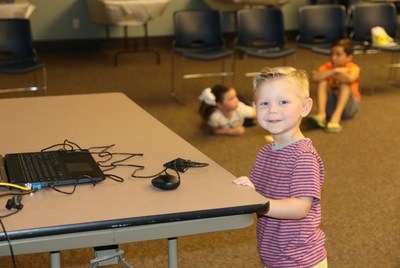 Child asking Terri Miller questions during live interaction