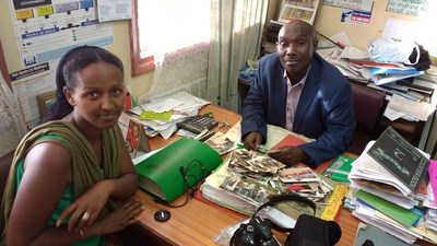Naima Dido visits with Paul Mbugua, headmaster at Woodard Langalanga Secondary School in Kenya. Mbugua was one of Dido's teachers when she was a student at the school.