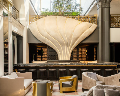 The Mayfair Hotel’s lobby lounge with M Bar and “The Mayfair Flower” sculpture taking center stage