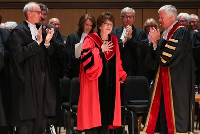 The Honourable Eleanore A. Cronk (centre) is congratulated by members of the Bar and Bench after receiving an honorary LLD from the Law Society of Ontario at the morning Call to the Bar ceremony on June 26, 2018 at Roy Thomson Hall in Toronto. Justice Cronk received the honorary LLD in recognition of her numerous contributions to the profession and the Bench. Shown here are The Honorable George R. Strathy, Chief Justice of Ontario (left) and Paul Schabas, Treasurer of the Law Society of Ontario (CNW Group/The Law Society of Ontario)