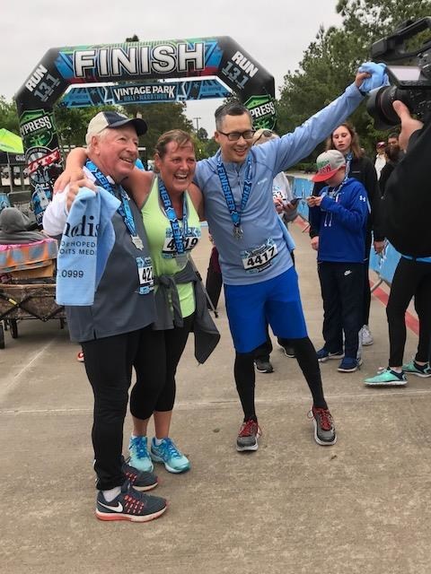 Larry Rand, Carrie Rand and Dr. Daniel Le, orthopedic surgeon and joint specialist at Houston Methodist Orthopedics & Sports Medicine at Willowbrook, at the finish line at the Vintage Park Half Marathon & 5K. Carrie and Larry Rand both received knee replacement surgery by Le and ran the 5K race. Le also ran the race with his patients.