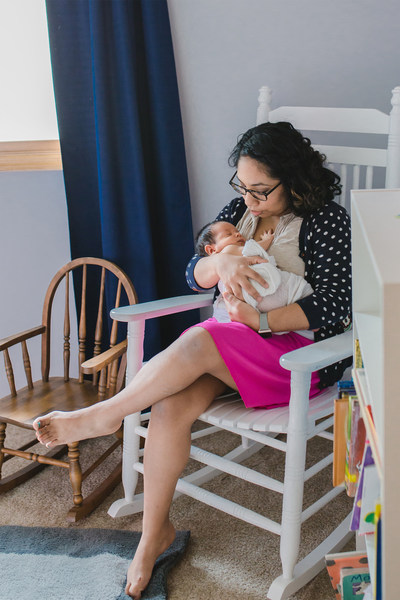 Military spouse and rocker recipient from the inaugural Operation Rocker program in 2016 enjoys time with her newborn baby shortly after receiving her rocker.