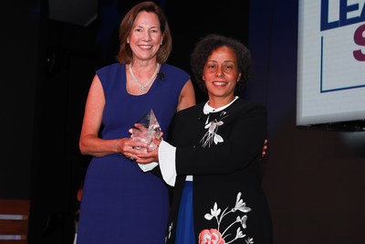 KPMG U.S. Chairman and CEO Lynne Doughtie (left) presents retired Four-Star U.S. Navy Admiral Michelle Howard (right) with the 2018 KPMG Inspire Greatness Award at the KPMG Women's Leadership Summit.