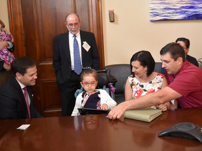 Senator Marco Rubio discusses health care legislation for children with complex medical conditions with Lisa and Russell Ferlita (front row, right) and Dr. Daniel Plasencia, medical director of St. Joseph’s Children’s Hospital (back row, center). The Ferlitas' daughter, Lucy, was born with an extremely rare condition that has left her with low muscle tone and the need for a feeding tube to eat and a ventilator to breathe.