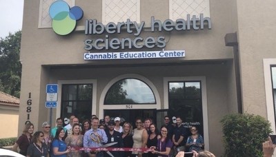 Nick Etten, Executive Director of the Veterans Cannabis project with the Liberty Health Sciences Team at the Ribbon Cutting Ceremony for the new concept launch of the LHS Cannabis Education Center at The Villages in Summerfield Florida. (CNW Group/Liberty Health Sciences Inc.)