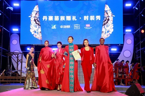 Miss Worlds Displaying Miao-style Wedding Clothing on the stage (PRNewsfoto/Dalian Wanda Group)