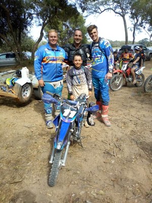 Professional riders Darren Gray (L) and Travis Teasdale (R) train children on how to race at the MAZ Siavonga 400 Enduro Race, which took place June 30 through July 2, 2018.