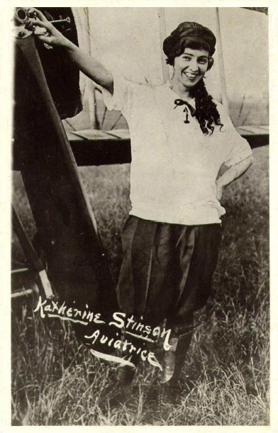 Aviatrice Katherine Stinson poses by her aircraft in 1918 (CNW Group/WESTJET, an Alberta Partnership)