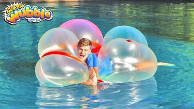 Vloggers Stephen and Carter Sharer (that's Carter, above) used duct tape to create giant Wubble rafts, which they raced across their pond.