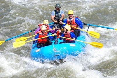 A raft from a member of the Arkansas River Outfitters Association navigates a rapid on the Arkansas River in Central Colorado.