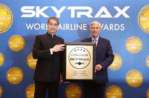 Hong Kong Airlines Vice Chairman Mr Tang King Shing (left) accepts the Skytrax 4-star award from Skytrax Chief Executive Edward Plaisted (right)