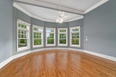 Although the property offers extensive home automation features, those features are set within a tasteful and elegant design. Wood flooring and bright, airy spaces are common throughout. Discover more at ConnecticutLuxuryAuction.com.