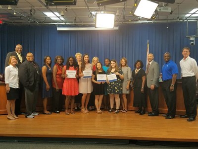 Comcast Leaders and Achievers scholarships recipients in Leon County along with local education leaders, including the superintendent and school board members.
