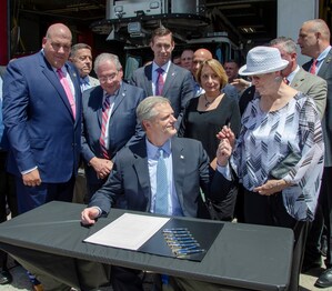 Surrounded By Firefighters, Governor Baker Signs Historic Cancer Legislation Bill