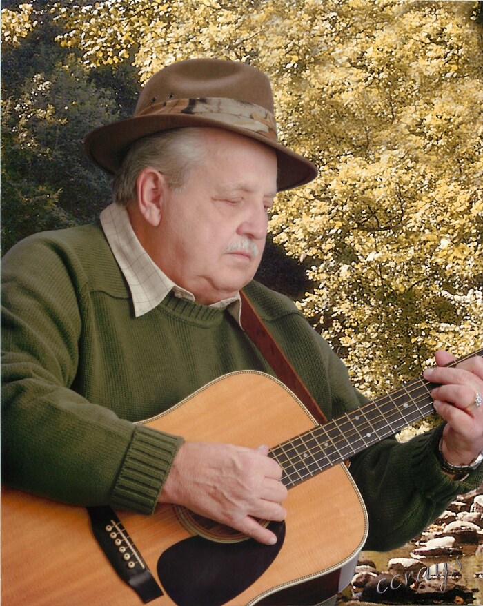 Bluegrass Songwriter and Singer Pete Goble with Guitar (PRNewsfoto/The Goble Family)