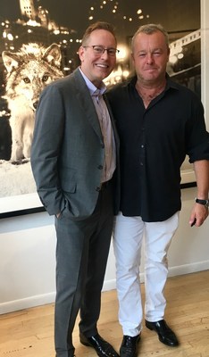 Famed photographer David Yarrow (right) and John C. Robak, Chairman of the Chicago Police Foundation, at the unveiling of Yarrow's Sweet Home Chicago photo at Hilton | Asmus Contemporary, a gallery in Chicago’s River North area.