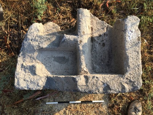 A 300 kg basalt stone with smoothly carved niches. This may have been the reliquary from the Byzantine church of Bethsaida that was built over the house of Peter and Andrew. If so, it may have contained remains of the Apostles.  (Credit: Mordechai Aviam)