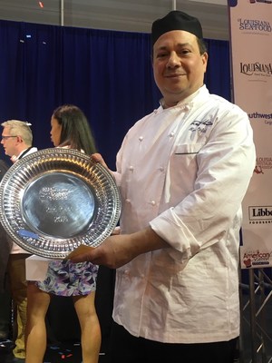 Chef Marc Orfaly posing with his award at the 2018 Great American Seafood Cook-Off in New Orleans, LA