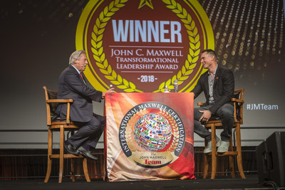 Movement Mortgage CEO Casey Crawford (right) joins John Maxwell on stage in Orlando, Florida.