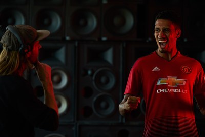 • Manchester United defender, Chris Smalling, celebrates in front of a wall of speakers during a Chivas film shoot in July in Los Angeles, United States. The film was released to announce Chivas as the "Official Global Spirits Partner" of Manchester United.
