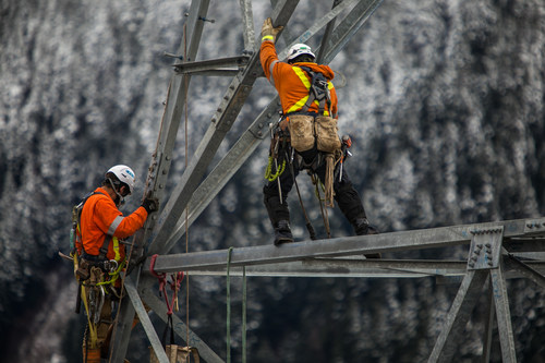 Rokstad Power linemen at work installing the high-voltage Interior-Lower Mainland transmission line, a 247-kilometre-long upgrade to the provincial power grid. (CNW Group/Rokstad Power Ltd.)