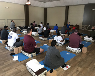 Warriors and guests participate in yoga lessons as part of Wounded Warrior Project's physical health and wellness program.