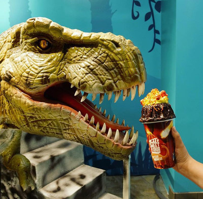 A Robotic T-Rex eating a Meteor Madness milkshake