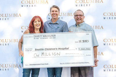 Columbia Winery's Sean Hails and John Sportelli present $1 million check to Shelley Tomberg of the Auction for Washington Wines, benefitting Seattle Children's Hospital