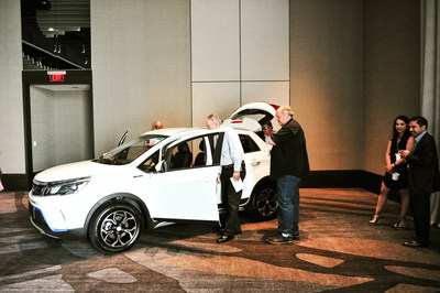 Guests view the EX3 SUV model at unveiling.