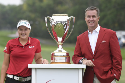 CP President and CEO Keith Creel joins CP Ambassador Brooke Henderson with the newest addition to her trophy case - the 2018 CP Women's Open trophy. (CNW Group/Canadian Pacific)