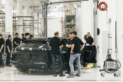 Teams gather round first pre-production FF 91 at Hanford factory during company First Pre-Production on-site event.