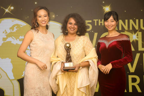 Nidhi Gopal, senior general manager, Deccan Odyssey (centre), is all smiles as she collects the winner’s trophy for the luxury train. Deccan Odyssey has been voted as Asia’s Leading Luxury Train at the World Travel Awards held in Hong Kong recently (PRNewsfoto/Deccan Odyssey)