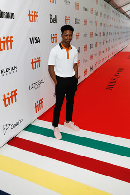 TIFF Rising Star Lamar Johnson, The Hate U Give, is the first to walk the Hudson’s Bay signature striped carpet at Roy Thomson Hall. (Photo credit: George Pimentel Photography) (CNW Group/Hudson's Bay)