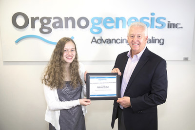 Organogenesis President and CEO Gary S. Gillheeney, Sr. presents 2018 scholarship winner Addison Mirliani with the award for her winning essay that detailed a long-term love for the sciences and desire to meld her passion for laboratory work with her interest in making a difference.