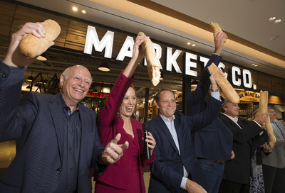 From left to right, Tony Van Bynen, Mayor of Newmarket; Bri-Ann Stuart, Director & General Manager Upper Canada; and Bradley Jones, Head of Retail Oxford Properties break bread to celebrate the grand opening of Market & Co. at Upper Canada. (CNW Group/Oxford Properties)