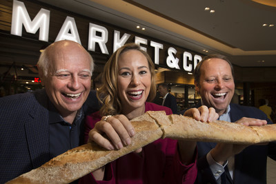From left to right, Tony Van Bynen, Mayor of Newmarket; Bri-Ann Stuart, Director & General Manager Upper Canada; and Bradley Jones, Head of Retail Oxford Properties break bread to celebrate the grand opening of Market & Co. at Upper Canada. (CNW Group/Oxford Properties)
